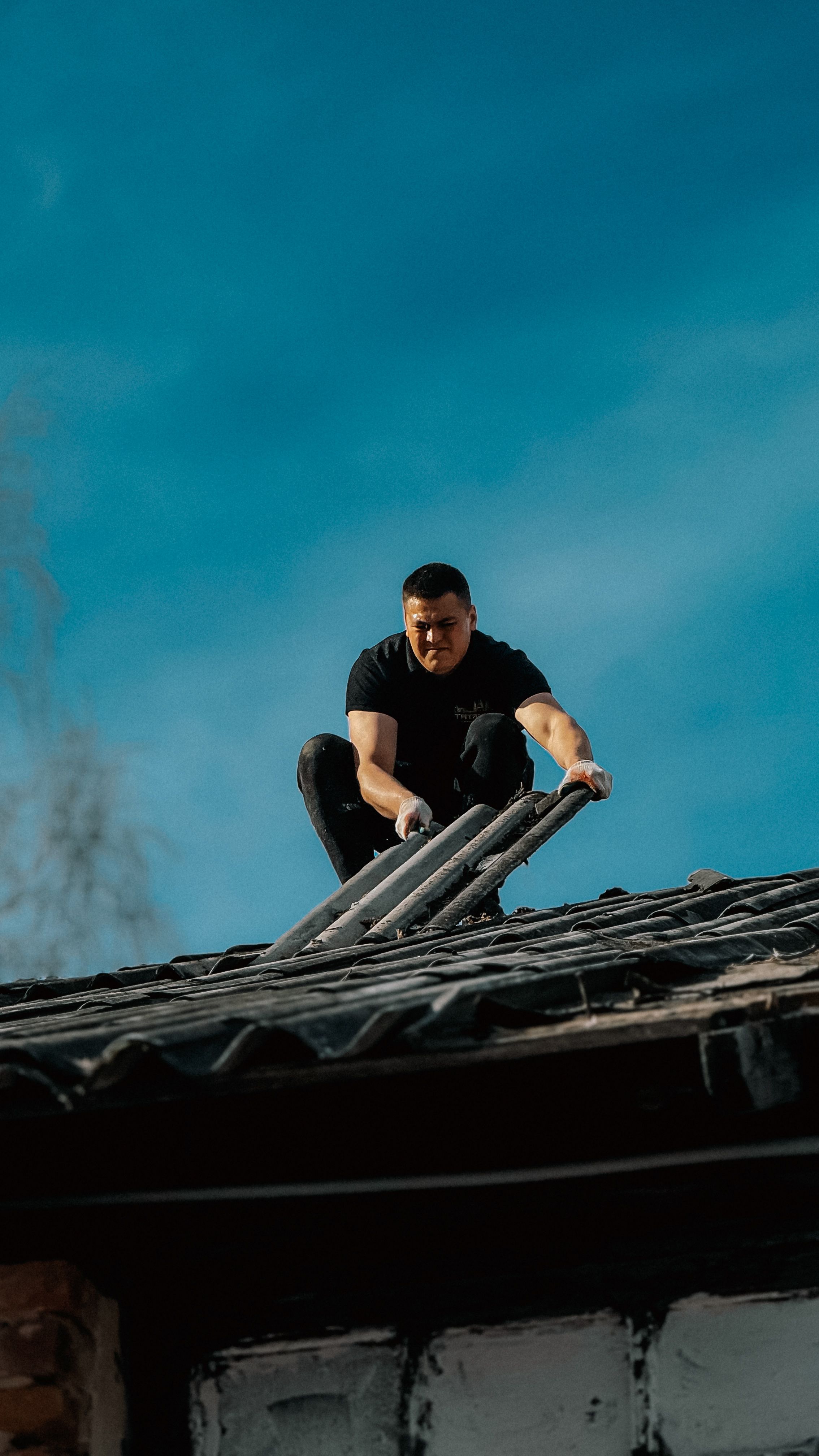 Apex Roofing crew repairing a residential roof